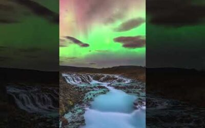 A geomagnetic storm illuminates Iceland’s stunning Brúarfoss waterfall with green and red hues 💚